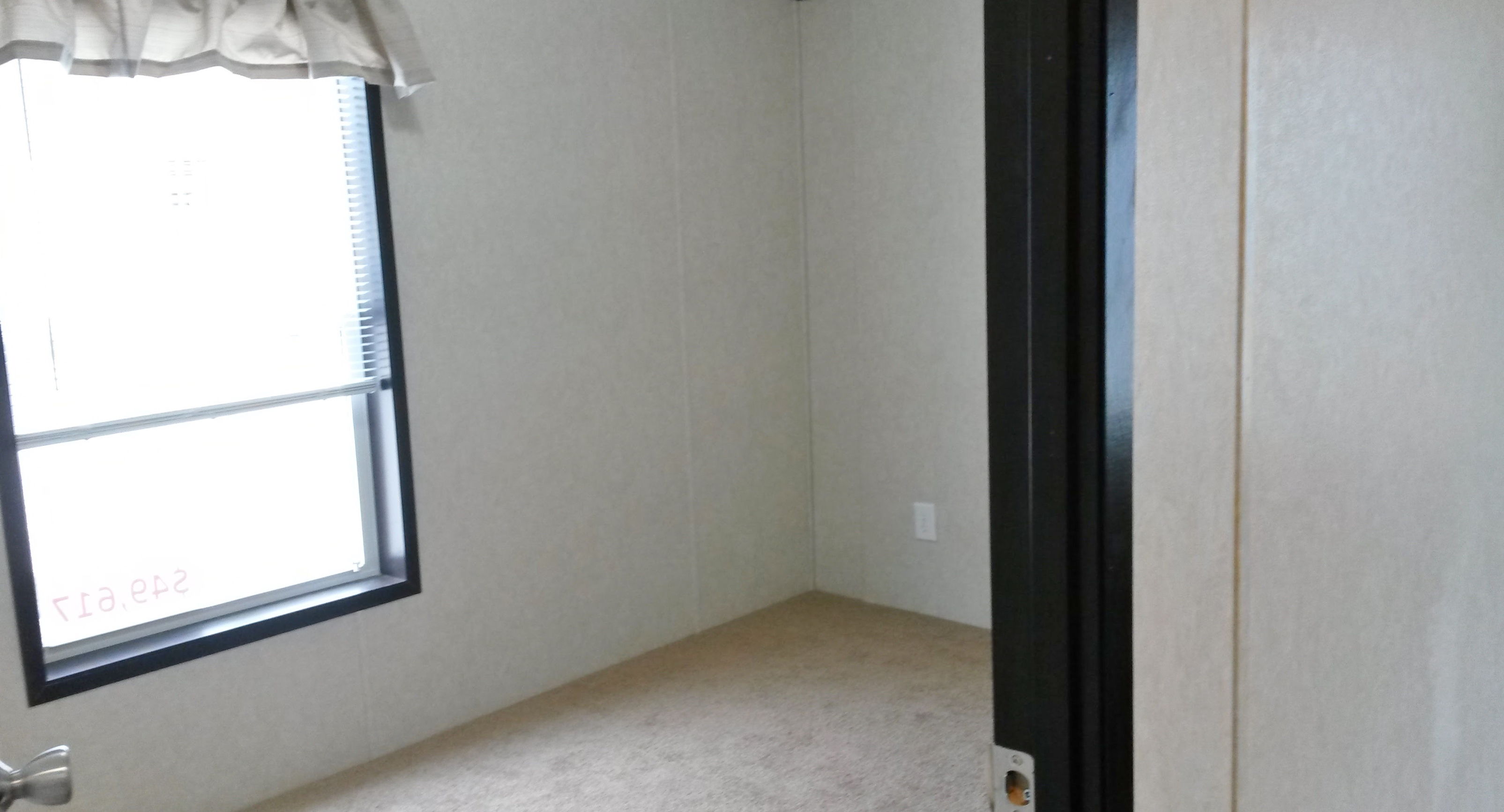 Bedroom 3 sits adjacent to the den