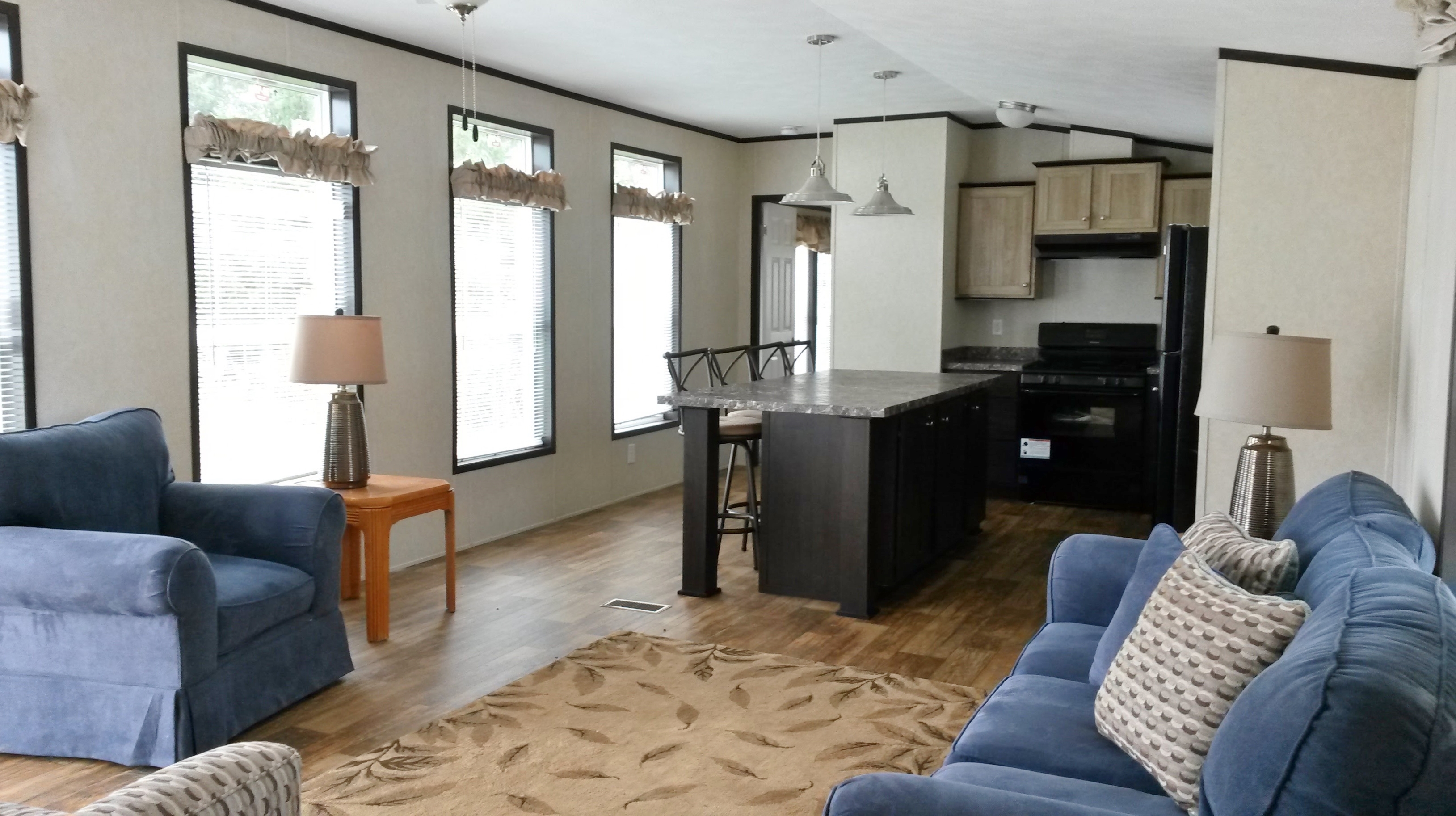 Another view of living room and kitchen area