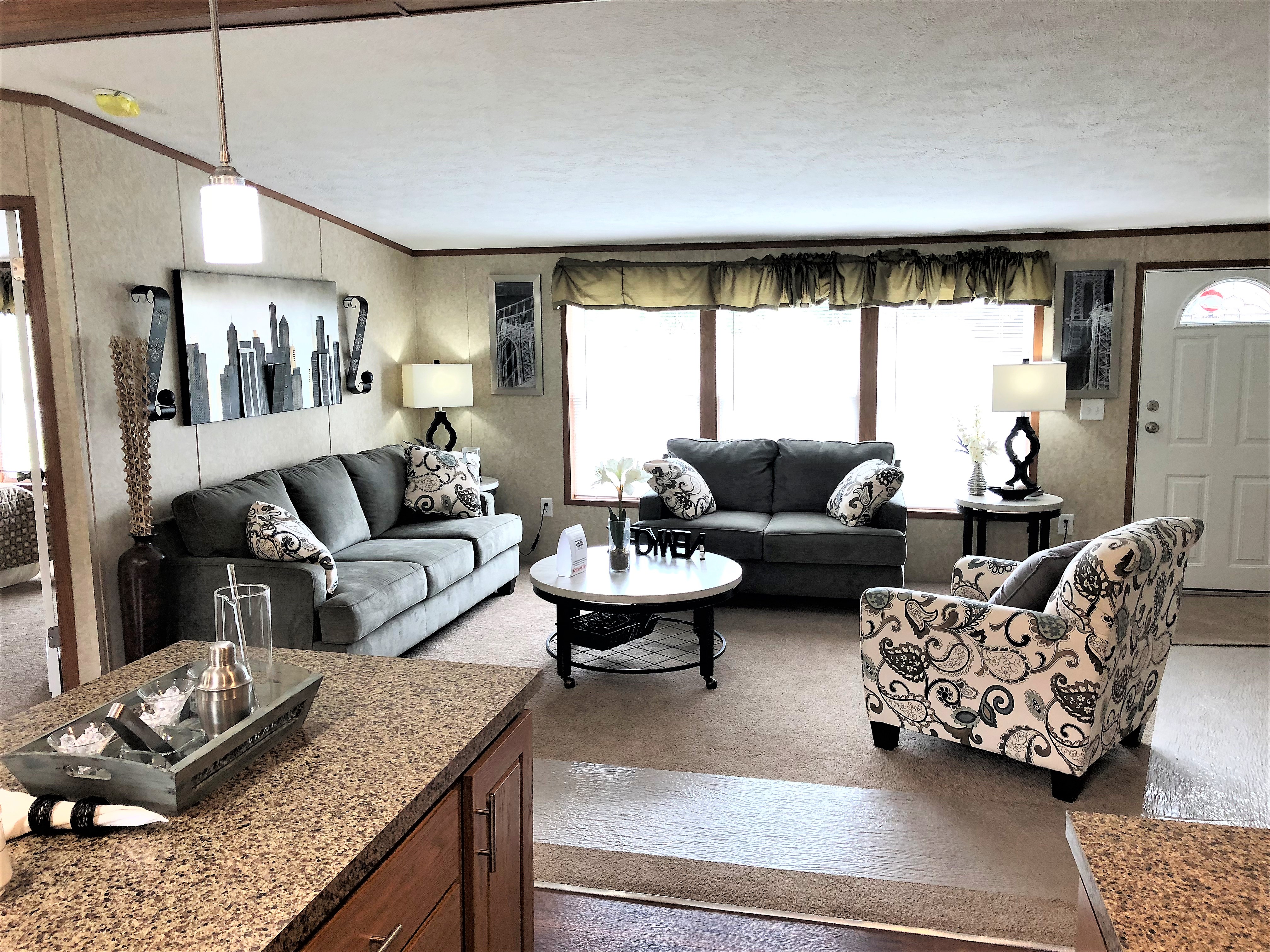 3 Large Windows In The Living Room