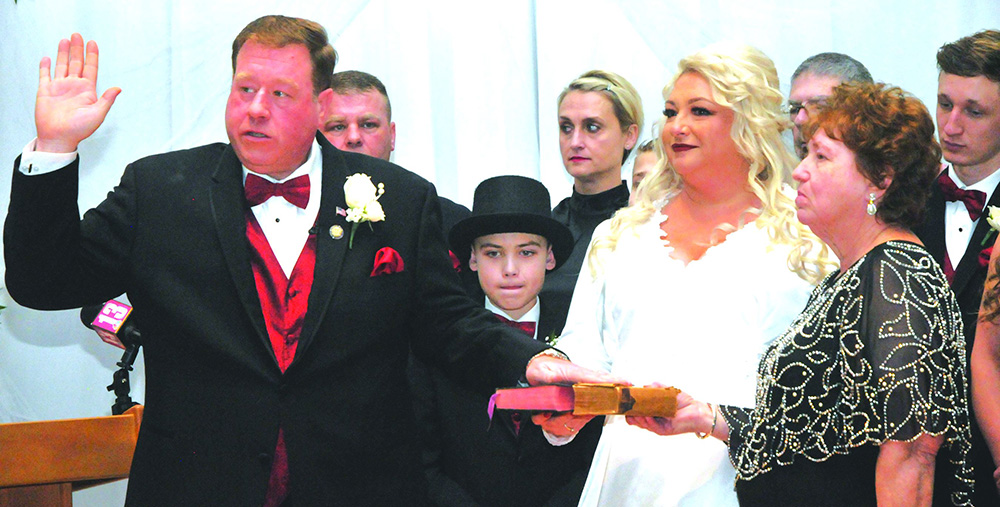 Tague marks New Year with wedding, swearing in