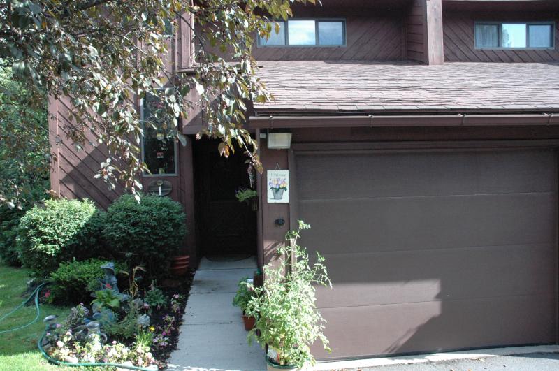 Enjoy carefree living in spacious 2 bedroom end unit condo. Living room has patio door and window along with gas fireplace. Kitchen & amd;DR have oak hardwood floors. Walk out Family rooom leads to deck and lovely yard . Monthly Maint. $165 Incl. Trash pickup, lawn Care and snow removal