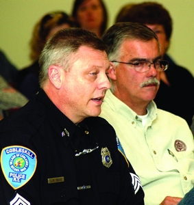 Village promises study, vote on cops