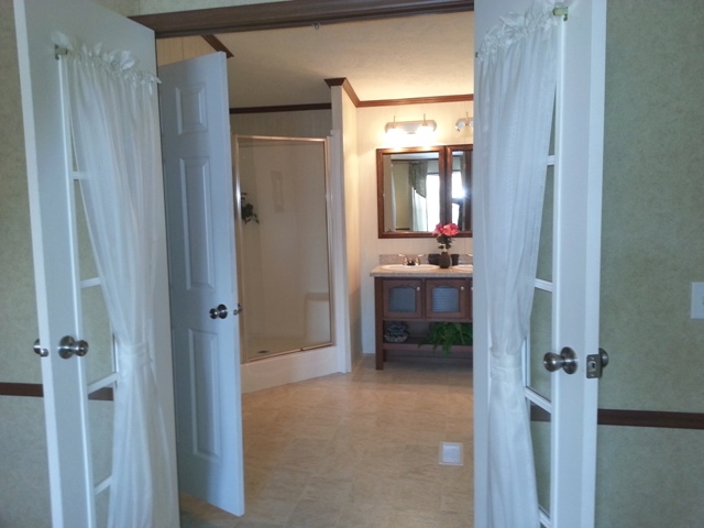 French doors lead to master bath