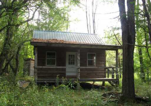 GREAT piece of hunting recreational land on private road. 5.49 acres with 16X20 cabin, wood burning stove,front porch,sleeping loft,state land access. Hunting, ATV on private road system, snowmobile trails near, 1000s of acres of state land, fishing, state parks near. Ready to go for this hunting season.