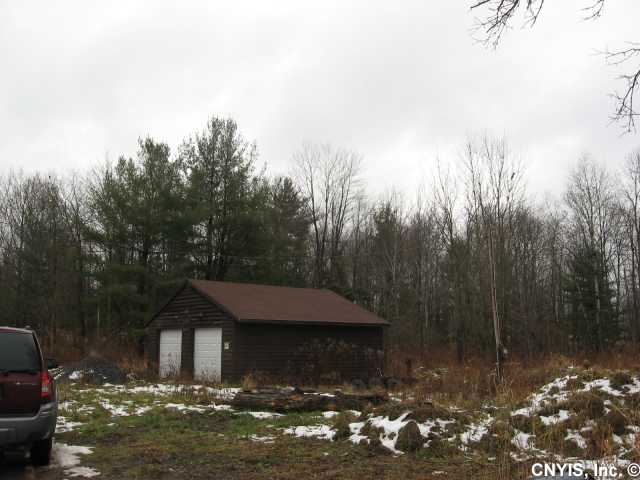 Nice parcel for home, with 24X24 two car garage, electric,water & sewage in place.Just a few hundred feet from snowmobile trail if wanted for recreation use and store snowmobiles in garage. located less than 1/4 mile from Oneida Lake for fishing, boating, swimming etc.