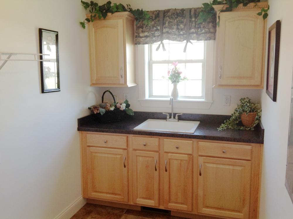Utility room cabinets and sink.