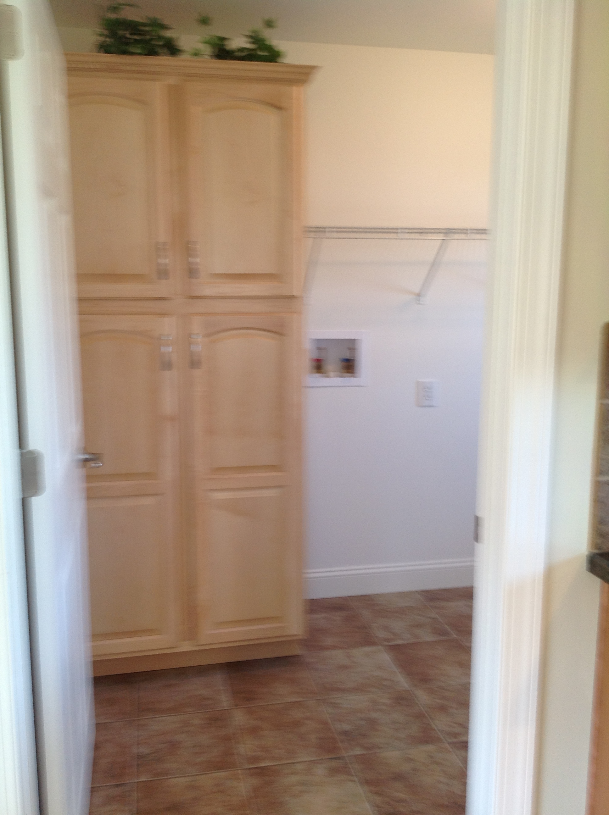 Optional pantry cabinet in the utility