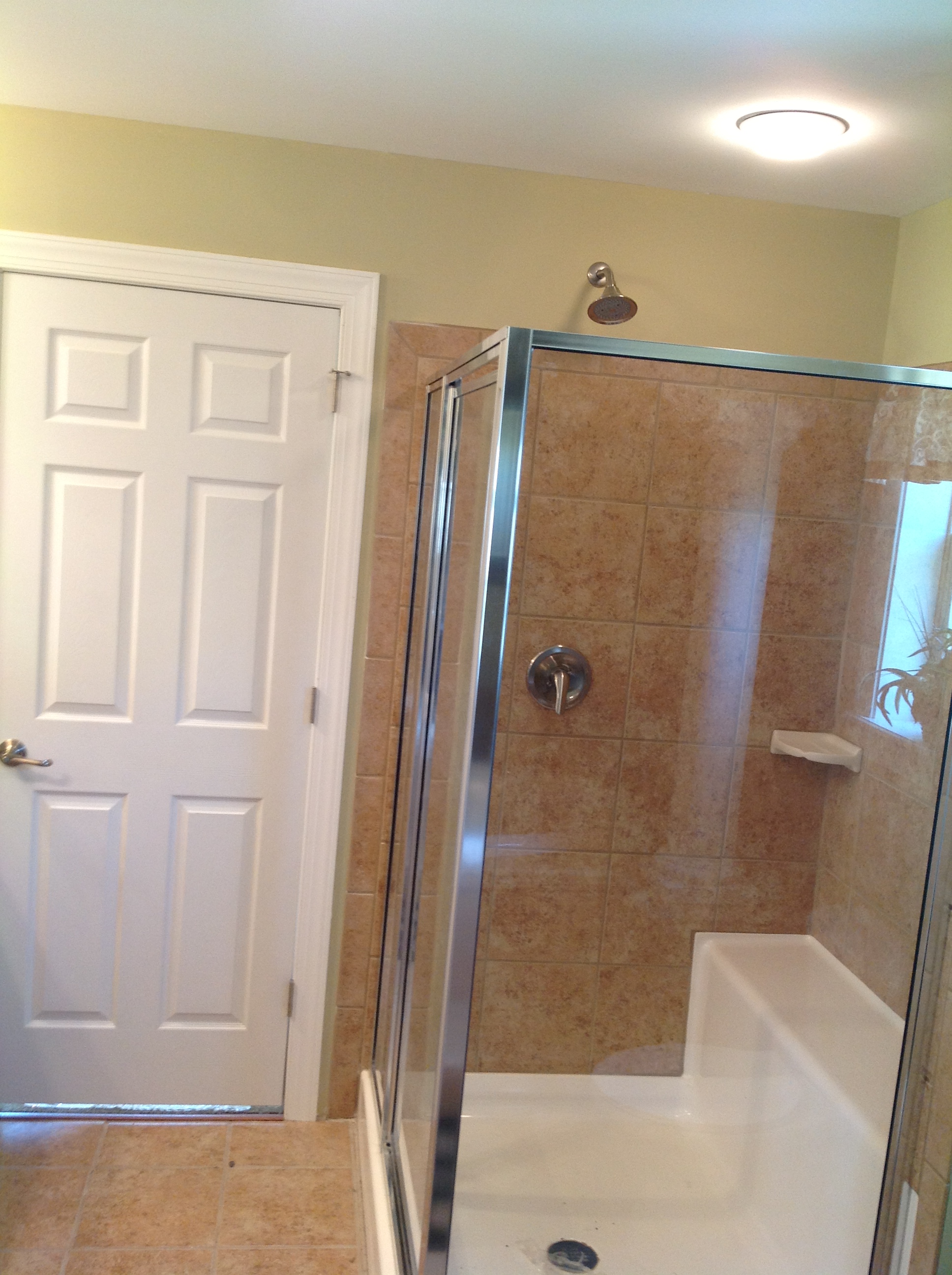 Optional ceramic shower with seat.