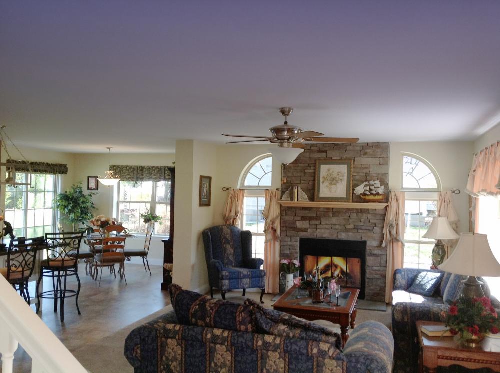 A view from the foyer looking into the living room and nook.