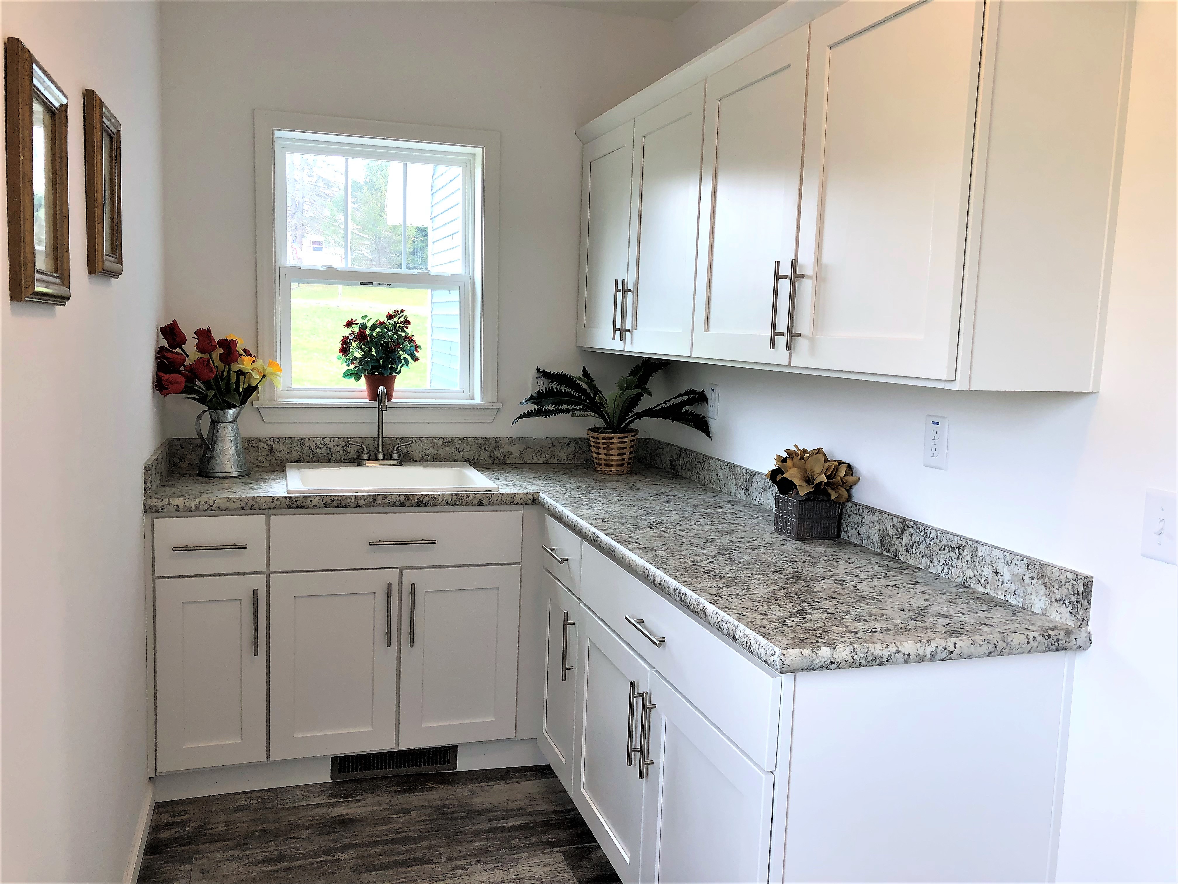 This Optional Utility is Shown With Optional White Cabinets