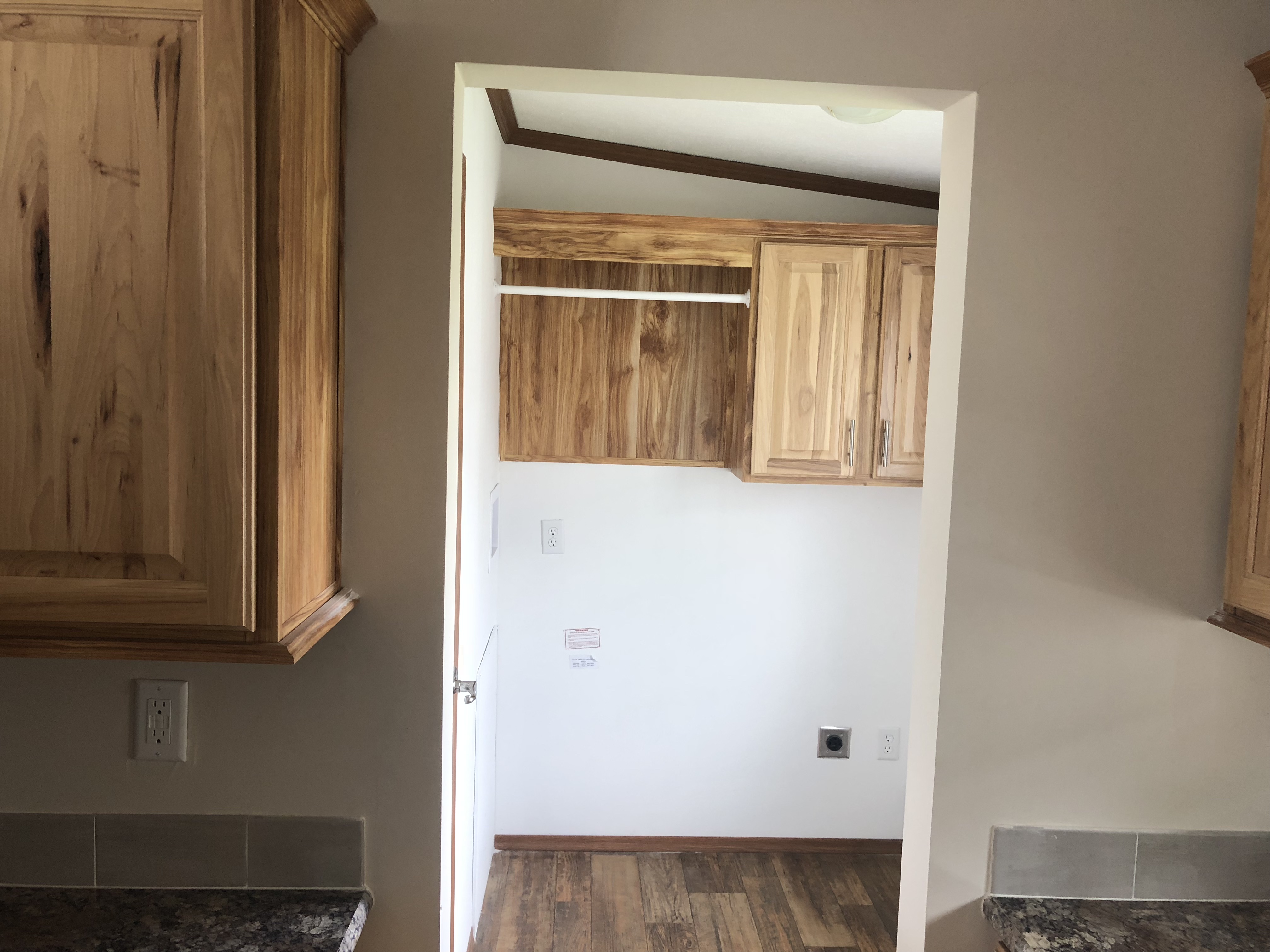 Utility Room With The Washer Dryer Cabinets