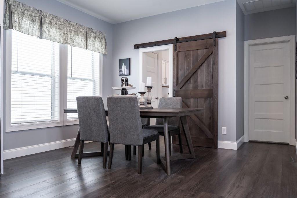 View Of The Nook And Barn Door To The Utility Room