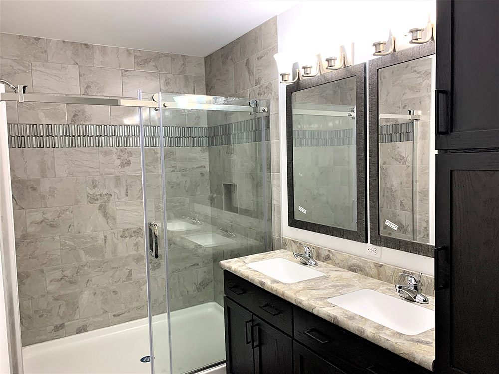 Ceramic Shower With Glass Barn Door Application And Undermount Sinks