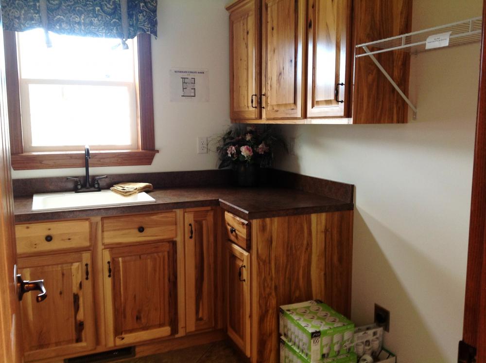 Utility room cabinets and sink.