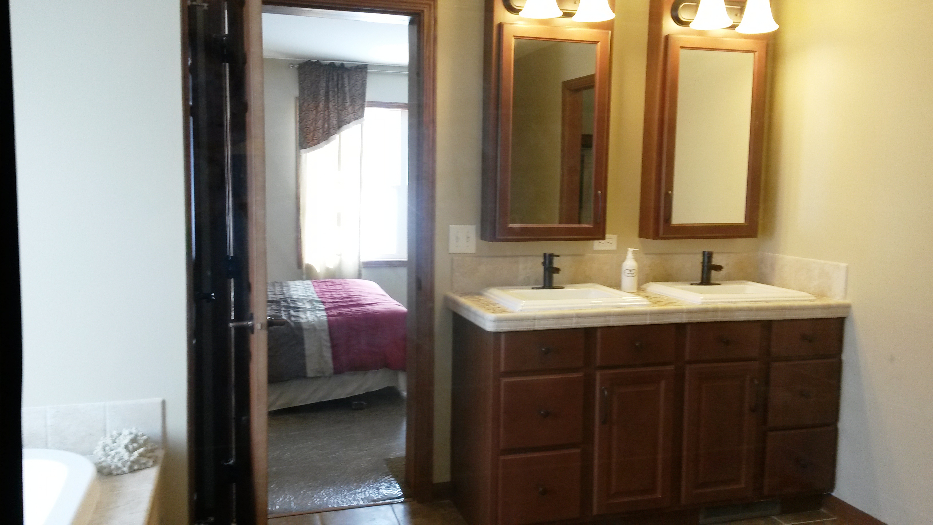 His and her medicine cabinets with mirror.